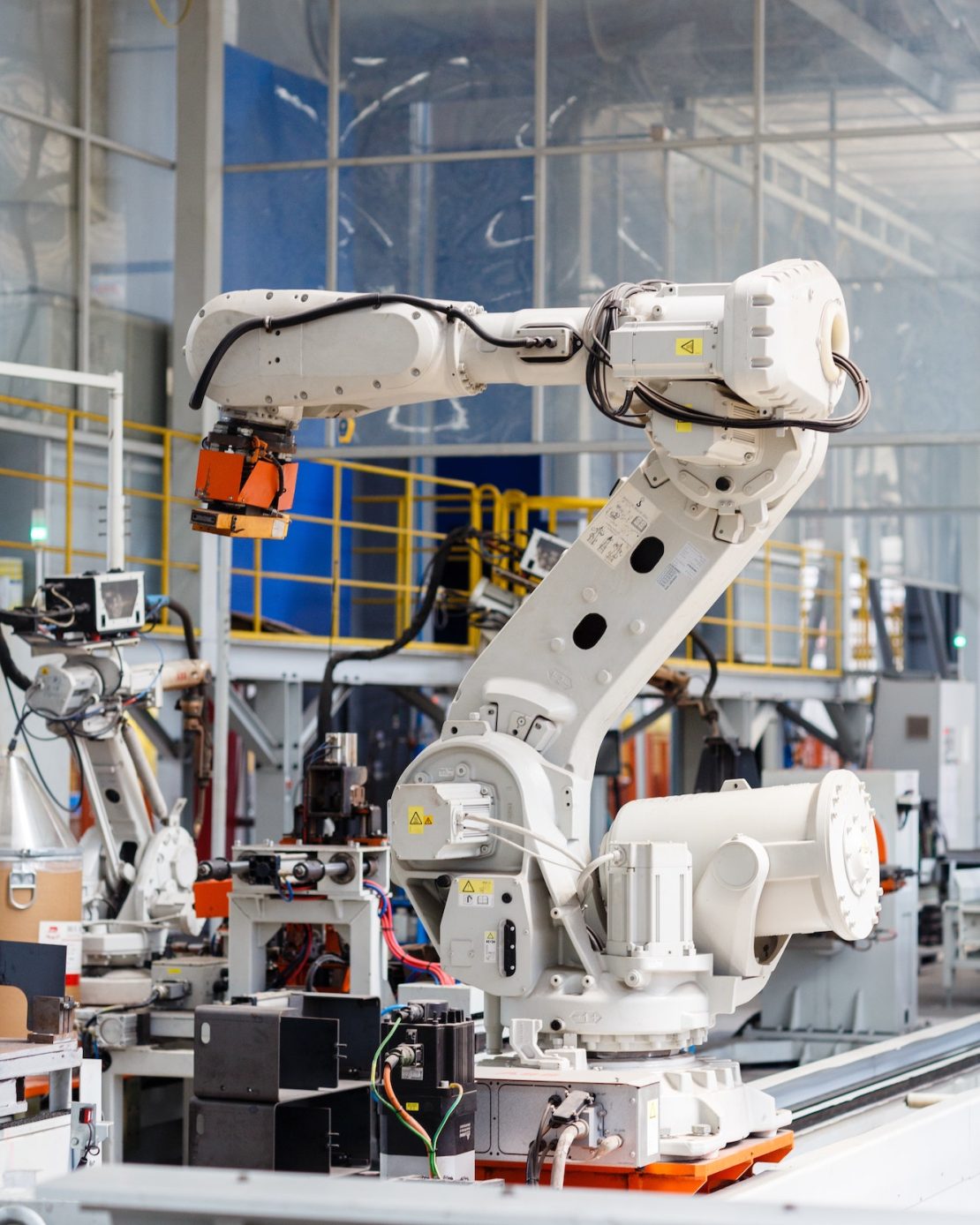 Industrial photo of Robot which working on modern factory and doing laser cutting
