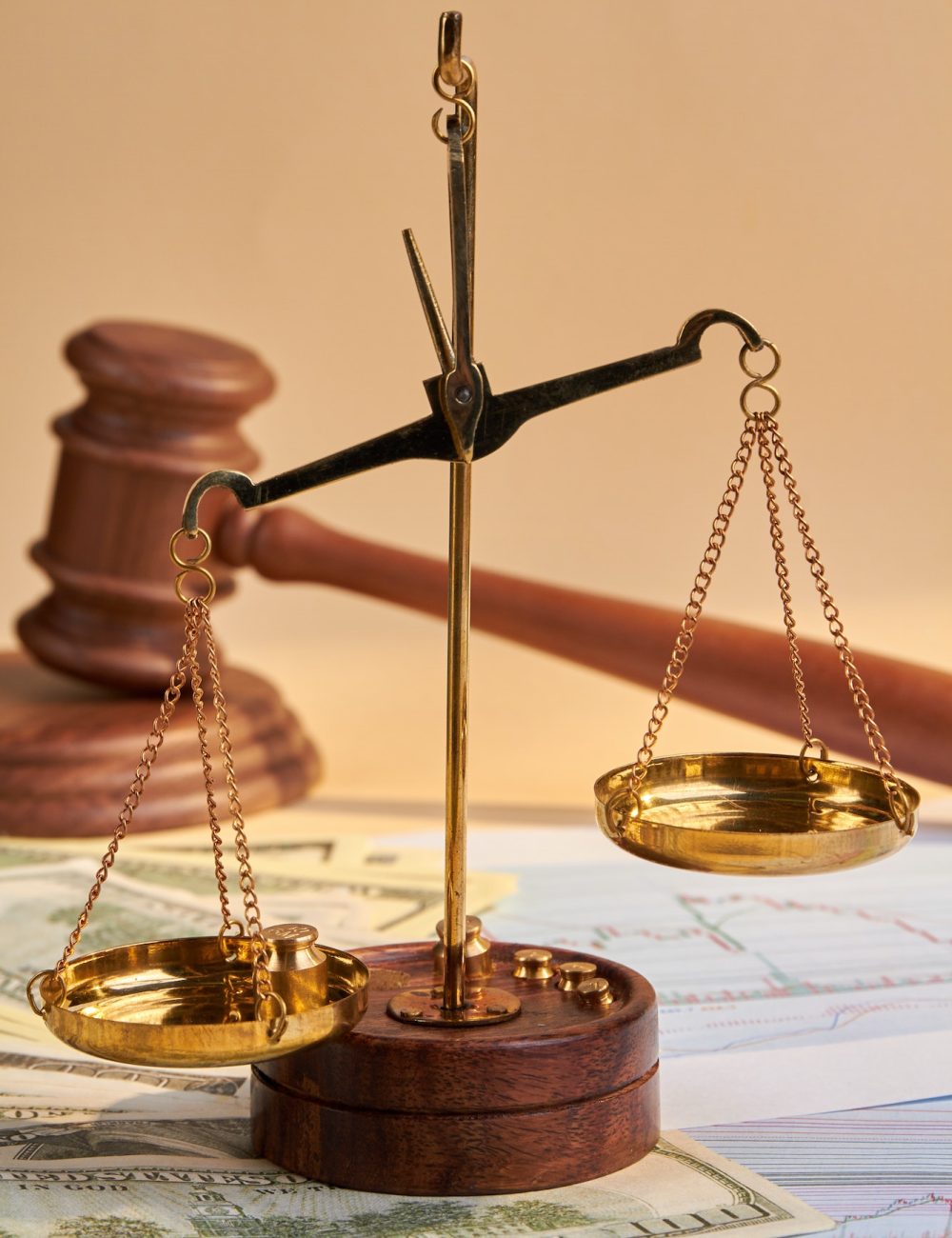 Close-up scales and wooden judge gavel hammer
