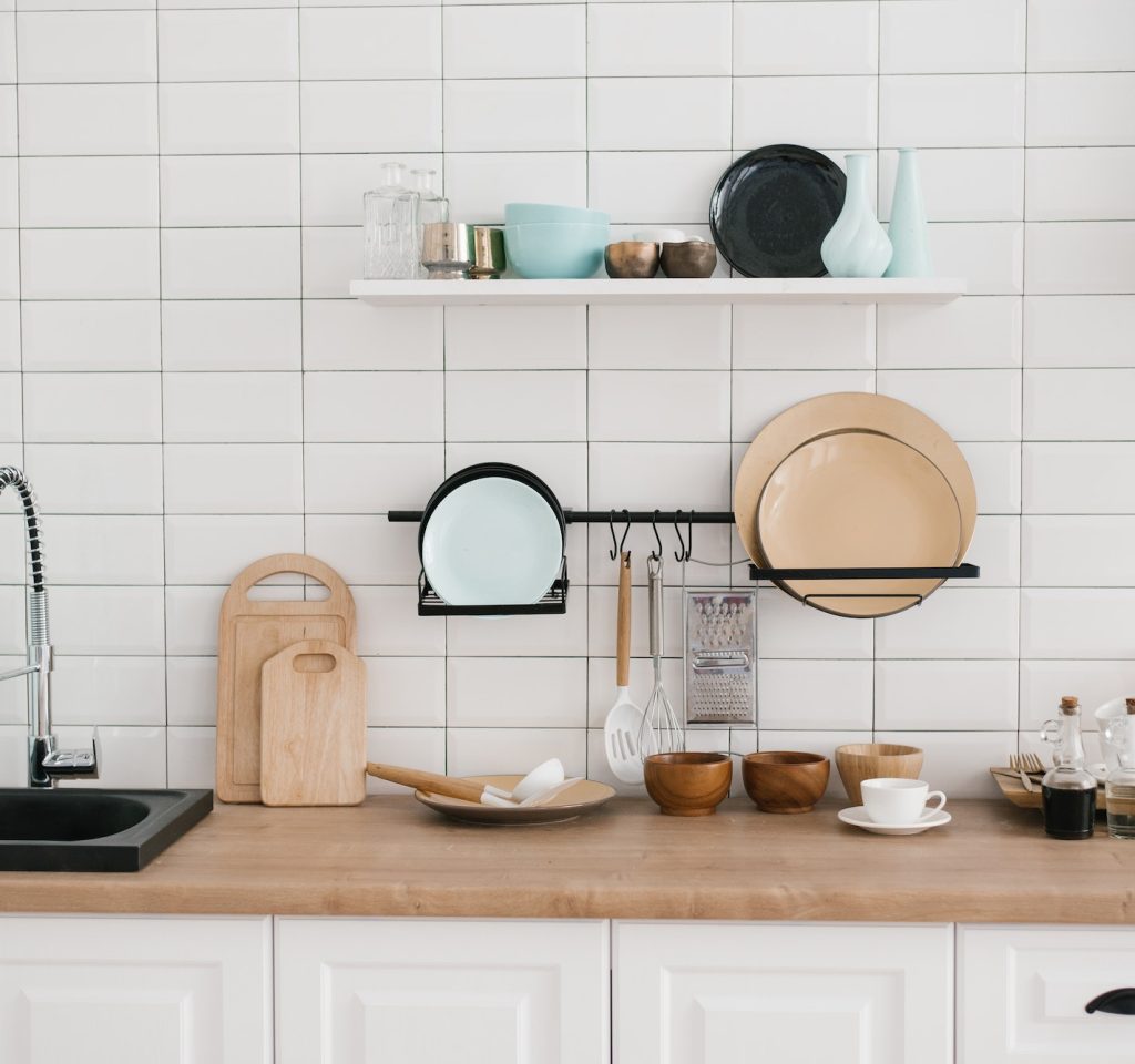 Kitchen utensils and utensils in the bright white wooden kitchen
