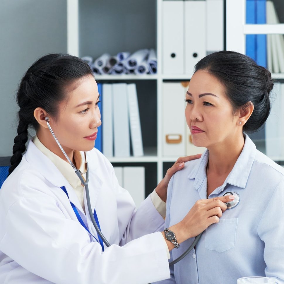 Doctor Checking Breath of Patient